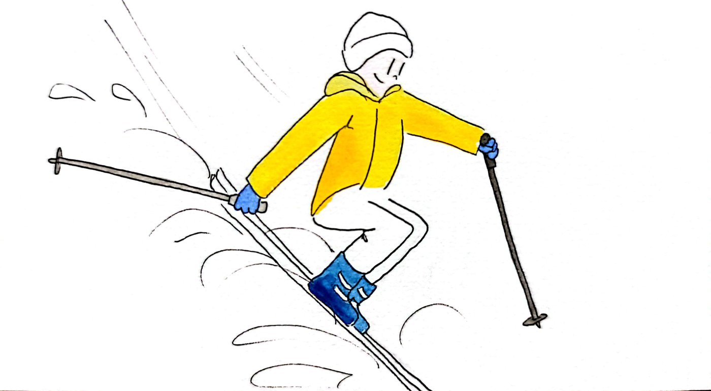 Skieur en anorak jaune qui dévale la pente